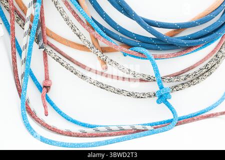Multicolored ropes on a white background close-up. Stock Photo