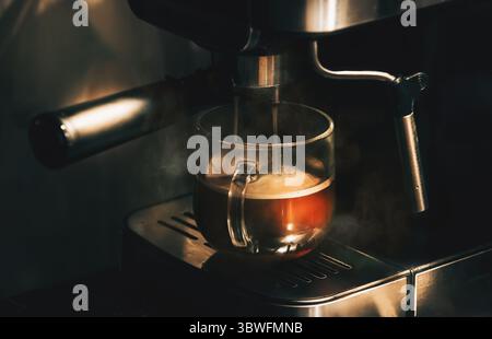 Making delicious morning coffee in a coffee machine Stock Photo