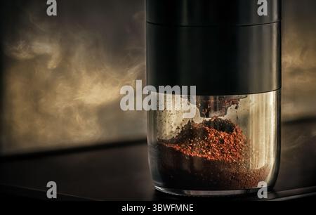grinding coffee beans in a coffee grinder Stock Photo