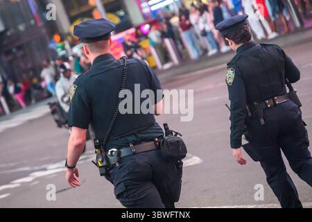 Police officers patrolling Times Square, New York City, USA Stock Photo ...