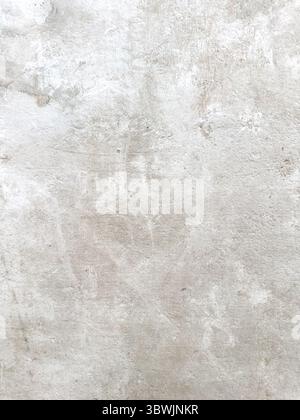 Abstract background featuring a pale, mottled grey texture, showcasing a slightly rough, stone-like appearance suitable for overlays and digital desig Stock Photo