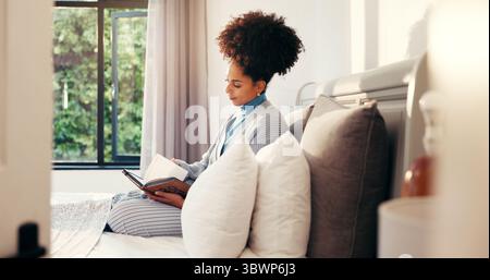Morning, woman and reading diary in bedroom for future goal, planning and growth in notebook. Relax, writing or person with journal for gratitude Stock Photo