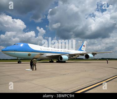 A U.S. Airman stands by Air Force One, as Marine One with President ...