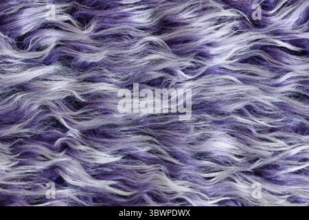 Close up of fluffy purple and white synthetic fake fur Stock Photo
