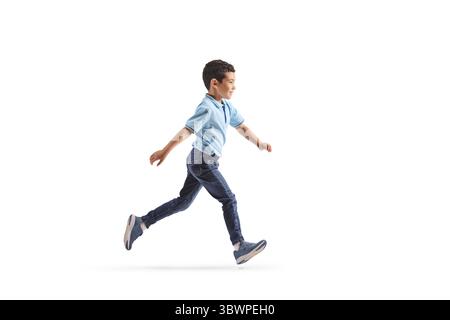 Full length profile shot of an asian boy running isolated on white background Stock Photo