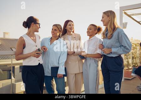 A Diverse Group of Talented Women Actively Engaging in Meaningful Professional Discussion Stock Photo