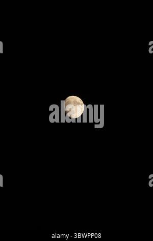 Half Moon in Dark Night Sky – Beautiful Lunar Phase with Craters Visible Against Black Space Background Stock Photo