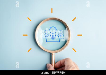 Teamwork startup innovation business idea magnifying glass focus group of people, leadership Stock Photo