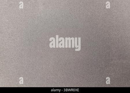 The texture of fine sandpaper close-up. Stock Photo