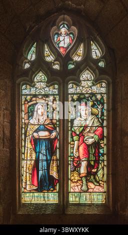 Stained glass windows at St Brelades church in Jersey where there are 8 Bosdet windows. Stock Photo