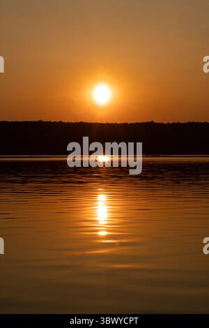 Sunset over a river Stock Photo