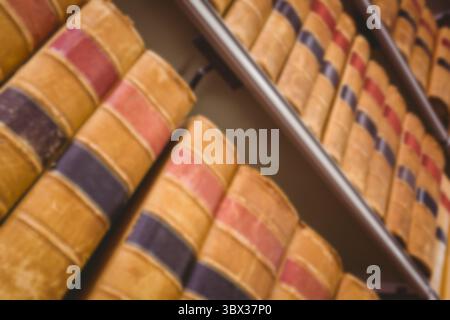 Close-up of yellow books on shelf in library Stock Photo
