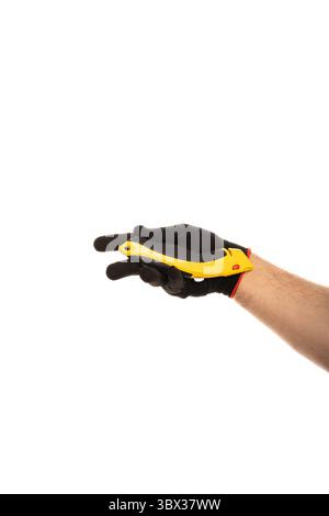 Segmented blade or snap-off blade utility knife in male hand isolated on white background. Stock Photo