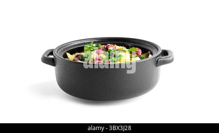 Baked potatoes with sausages, cheese and herbs. Potatoes in a black saucepan. High quality photo Stock Photo