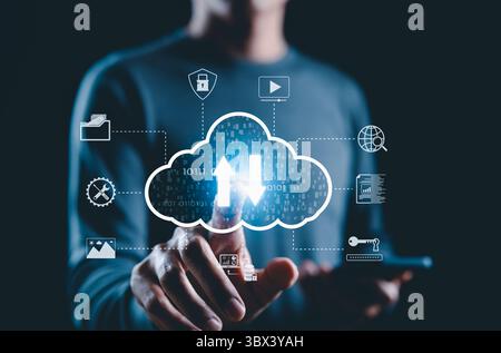 Cloud Storage and Data Transfer Technology Concept. A person touching glowing cloud icon with upload and download arrows, icons file sharing, backup, Stock Photo