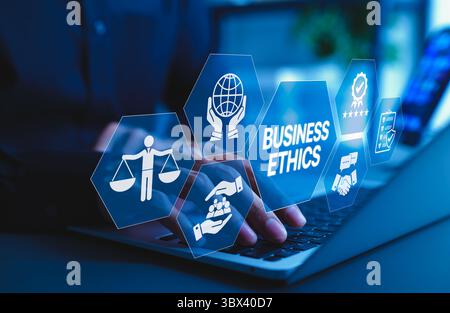 Business Ethics and Corporate Responsibility Concept. A businessman working on laptop with icons representing business ethics, integrity, corporate Stock Photo