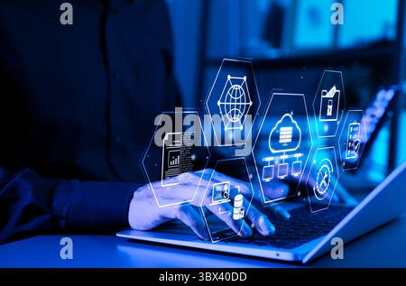 Data Management and Cloud Technology Concept. Hands typing on laptop with digital icons representing cloud computing, big data analysis, file security Stock Photo