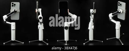 Smartphone in stabilizer gimbal for selfie recording different view isolated on studio background Stock Photo