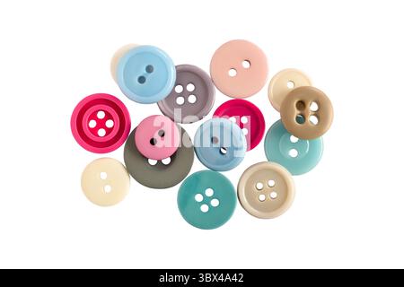 Group of pastel color sewing buttons isolated cutout on white Stock Photo