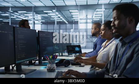 Woman putting headphones on in server room, developing disaster recovery plans ensuring minimal downtime. Engineer listening music in data center, using data analytics to monitor performance, camera A Stock Photo