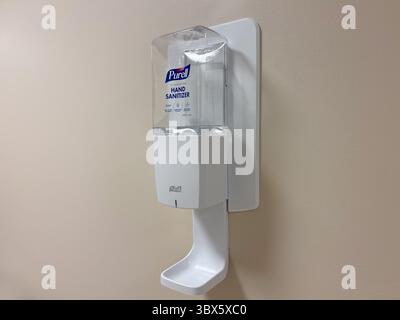 Wall-Mounted Purell Hand Sanitizer Dispenser Isolated Stock Photo