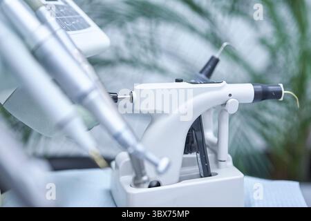 Close-up view of a professional dental microscope installed in a contemporary dental clinic. Stock Photo