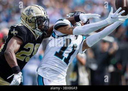Carolina Panthers wide receiver Robby Anderson, right, sits