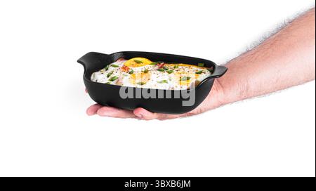 Eggs with bacon isolated on a white background. Baked scrambled eggs. High quality photo Stock Photo