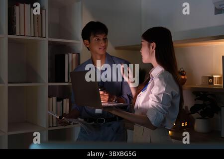 Engaged conversation between colleagues in a modern office Stock Photo