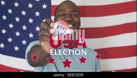 Adult man in T-shirt holding patriotic VOTE button in front of American flag, with election text Stock Photo