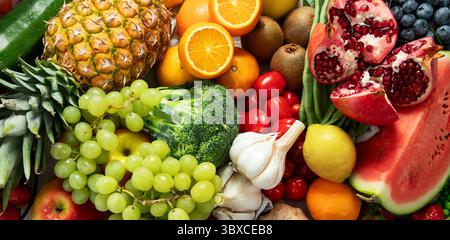 Various of healthy fresh vegetables and fruits. Healthy food for diet. Vegan food concept. Top view. Panorama. Stock Photo