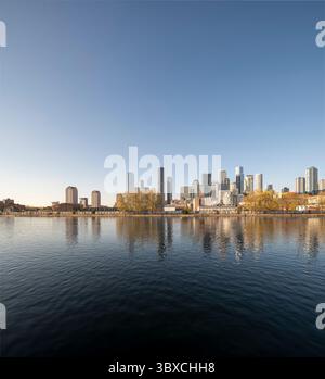 Canary Wharf skyline reflected in South Dock waters in London Docklands, England, UK Stock Photo