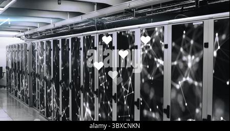 Displaying server racks, LED lights and overhead cable trays holding network cables in datacenter Stock Photo