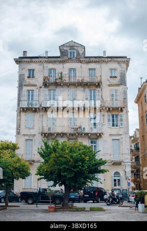 Weathered European Building with Balconies Stock Photo