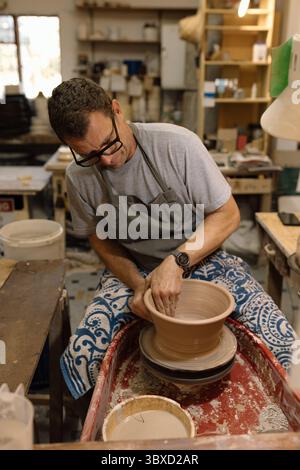 Artist in Ceramics and Pottery Studio working Stock Photo