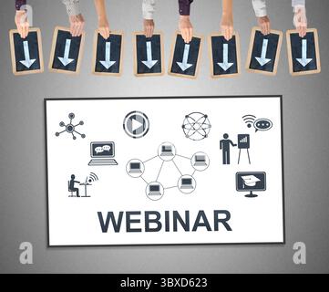 Hands holding writing slates with arrows pointing on webinar concept Stock Photo