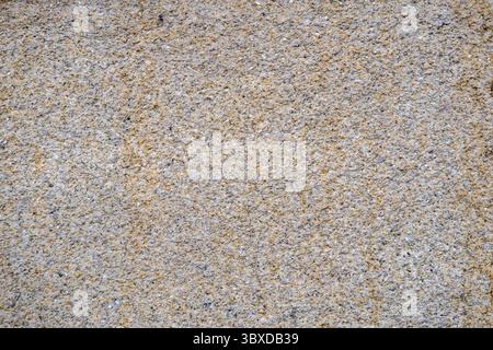 rough granite stone wall texture as a natural architectural background Stock Photo