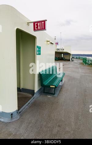 Exit sign and bench, Puget Sound ferry crossing from Edmonds to Kingston Stock Photo