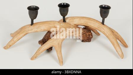 Horizontal deer antler shape with candles stacked on top of each other isolated nature background with clipping path Stock Photo