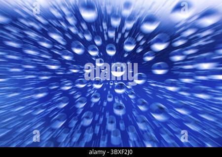 Zooming into clear raindrops on clear glass Stock Photo