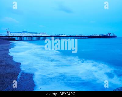 The Palace Pier at dusk Brighton East Sussex England Stock Photo