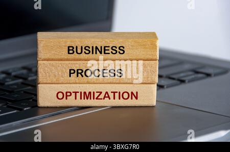 Business Process Optimization text on wooden blocks representing continuous improvement in business strategy Stock Photo