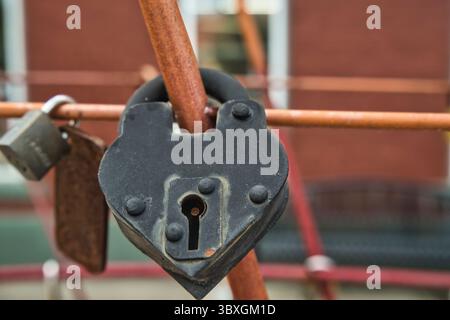 Old heart shaped padlock, up-close. USA 2025 Stock Photo