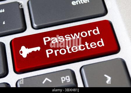 Password protected on red laptop keyboard button. Security and password concept Stock Photo