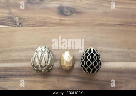 Trendy Easter low poly decor. Golden and black eggs of geometric style. Happy Easter greeting card. Holiday concept in minimal style Stock Photo