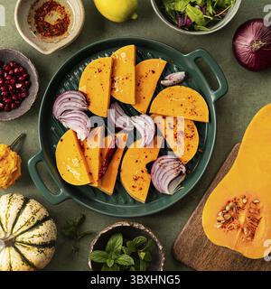 Food, Squash sliced into slices for baking. Ingredients for autumn salad. The concept of healthy eating Stock Photo
