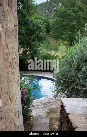 Round swimming pool in the park Stock Photo