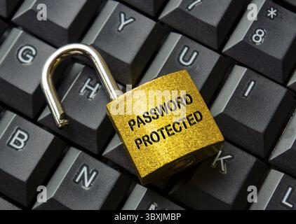 Top view of password protected text engraved on padlock with keyboard background. Password security concept Stock Photo