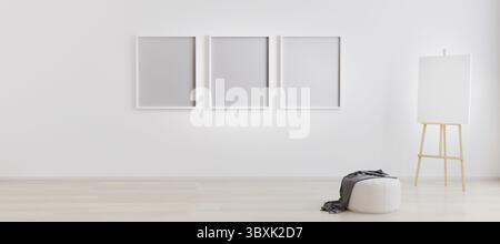 Easel with canvas in bright white room with three blank frames for mockup. Artist workspace. Empty bright room with three empty frames for mockup. Roo Stock Photo