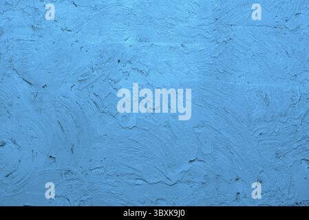 Blue background made with a texture of a plaster wall Stock Photo